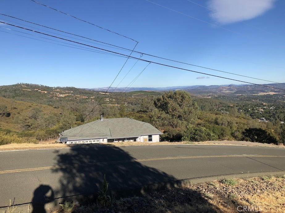 15927 Eagle Rock Road Hidden Valley Lake, CA 95467 - Photo 46 of 65 a view of a street with mountains in the background