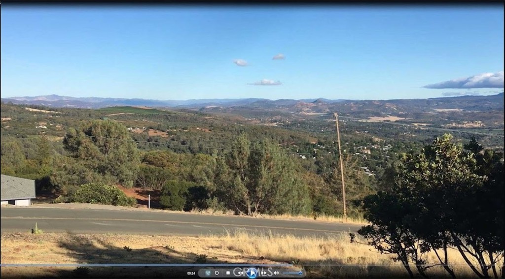 15927 Eagle Rock Road Hidden Valley Lake, CA 95467 - Photo 47 of 65 a view of a lake with mountains in the background
