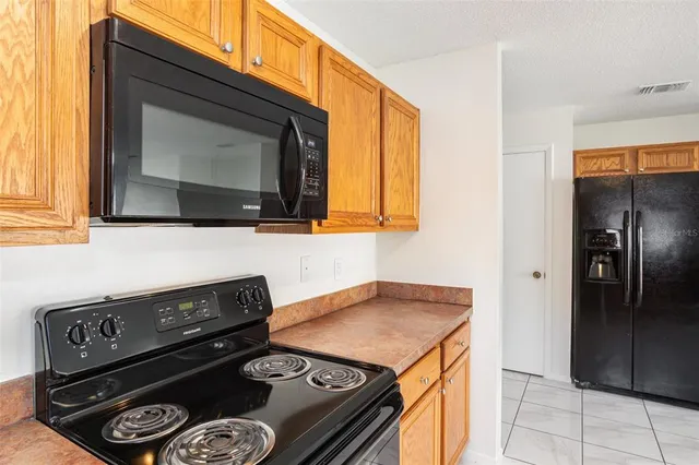 a kitchen with a stove and a microwave