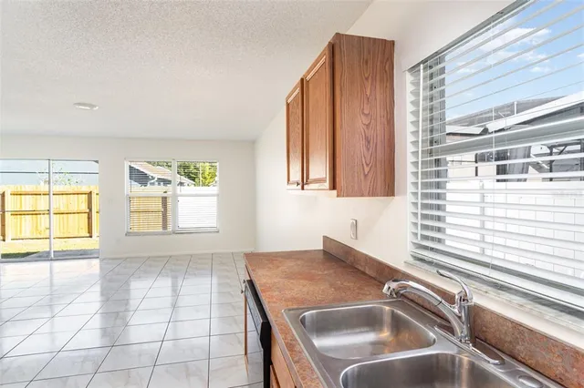 a kitchen that has a sink and a window
