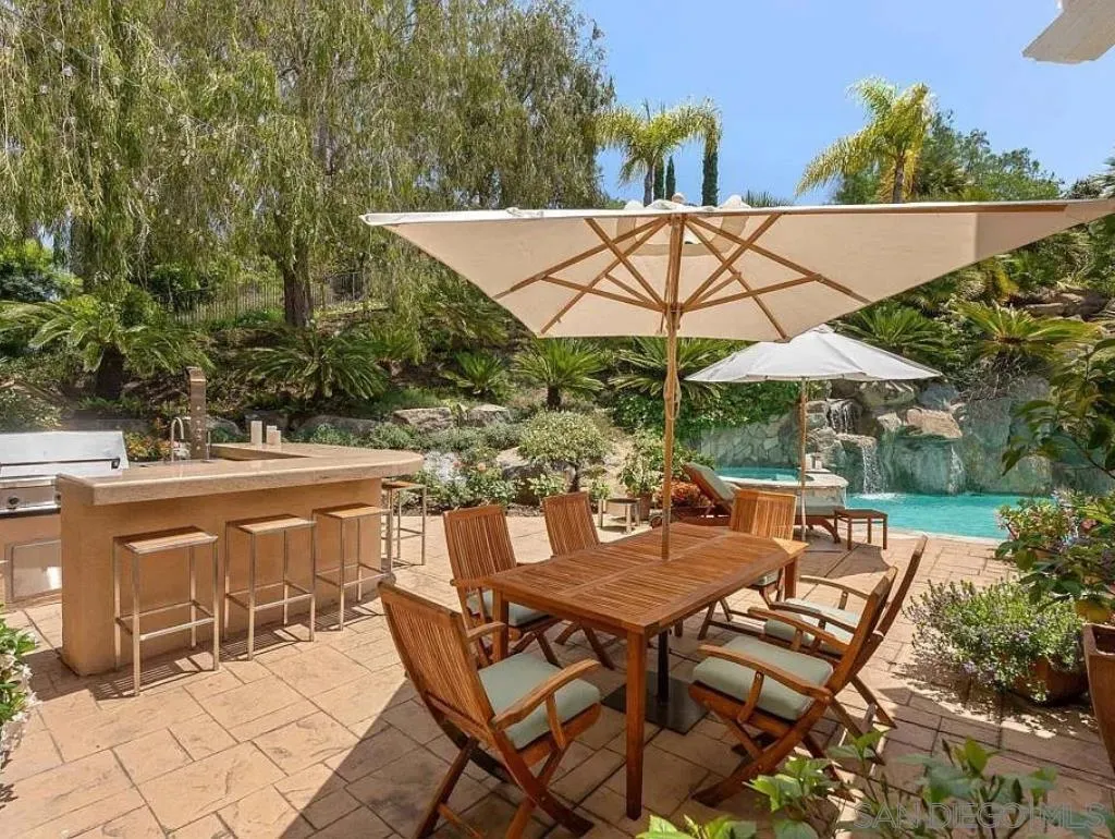 6369 Clubhouse Rancho Santa Fe, CA 92067 - Photo 17 of 25 an outdoor space with furniture and umbrella