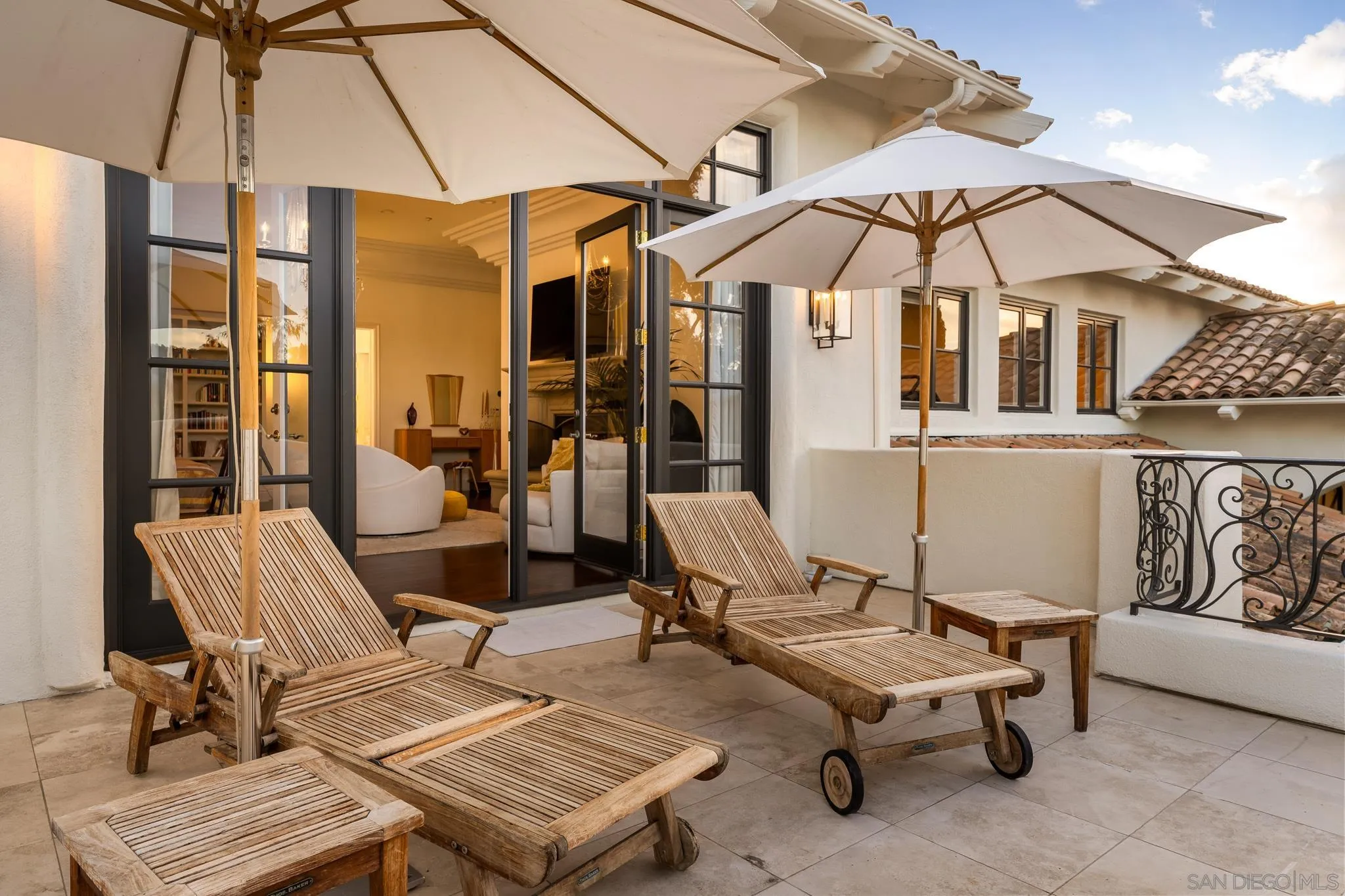 6369 Clubhouse Rancho Santa Fe, CA 92067 - Photo 19 of 43 a view of a patio with a table and chairs under an umbrella