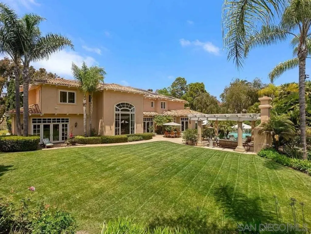 6369 Clubhouse Rancho Santa Fe, CA 92067 - Photo 22 of 25 a view of a house with a yard
