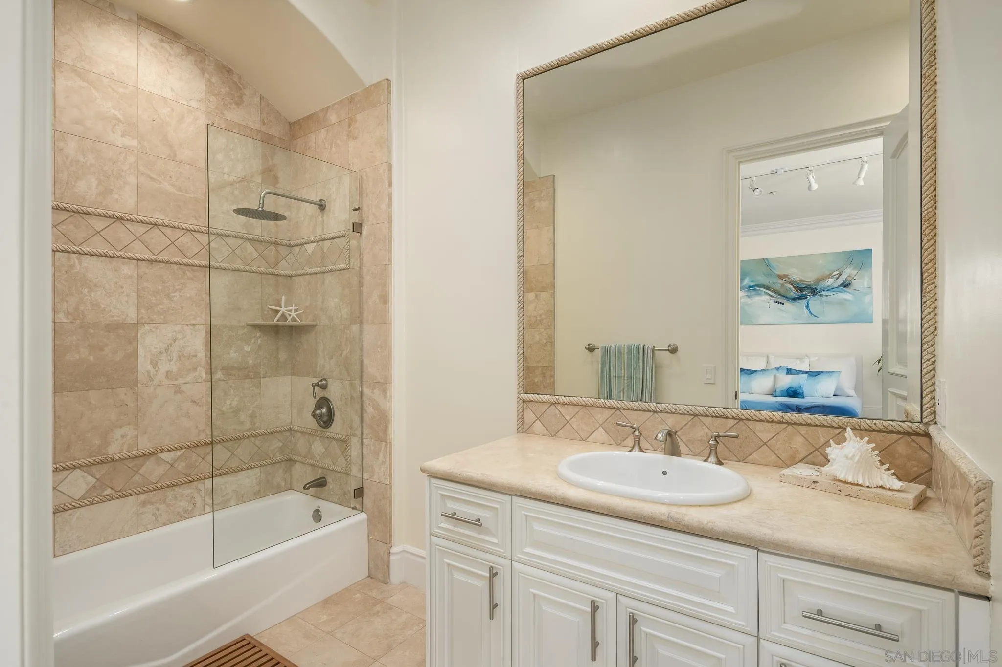 6369 Clubhouse Rancho Santa Fe, CA 92067 - Photo 26 of 43 a bathroom with a granite countertop sink a mirror bathtub and shower