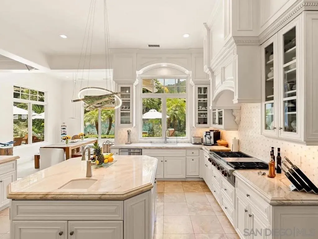 6369 Clubhouse Rancho Santa Fe, CA 92067 - Photo 6 of 25 a large white kitchen with a large window