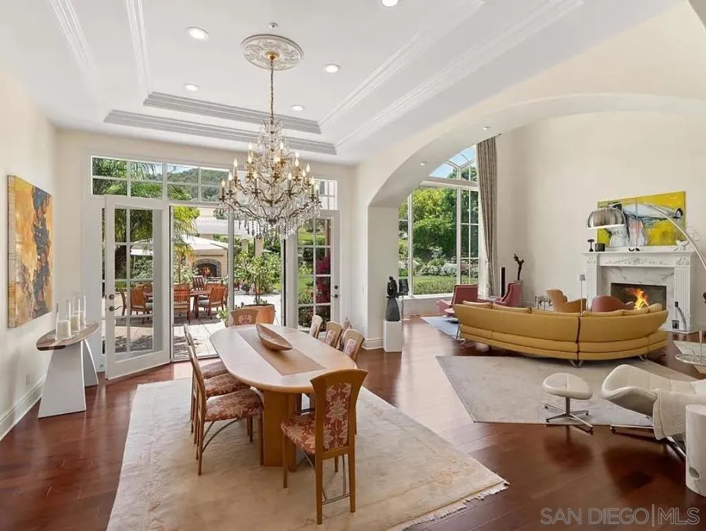6369 Clubhouse Rancho Santa Fe, CA 92067 - Photo 8 of 25 a living room with furniture and a chandelier