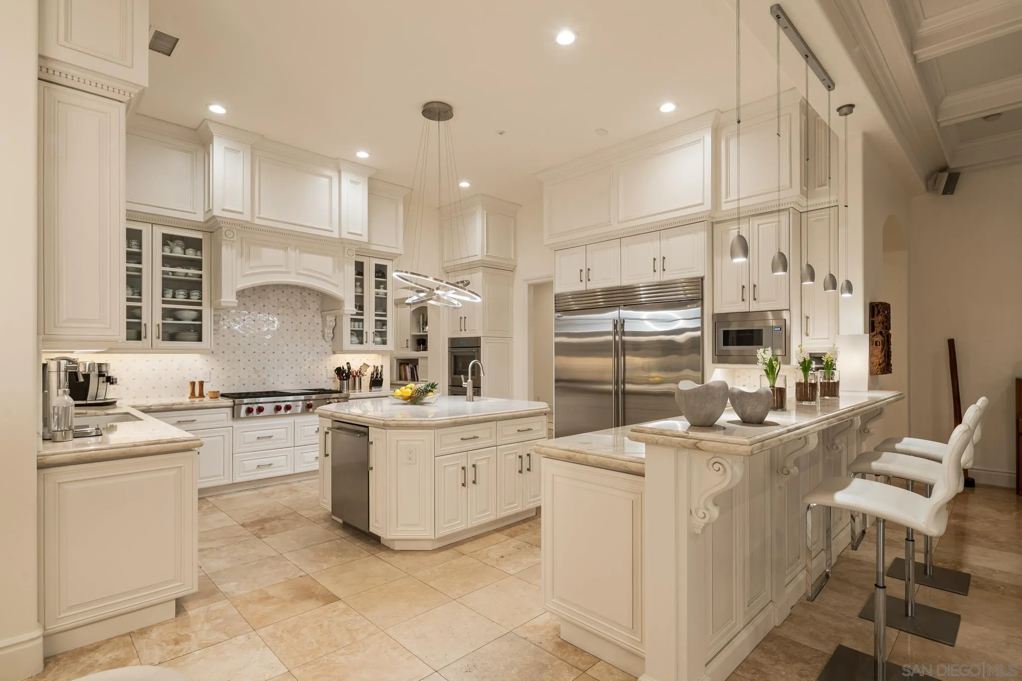 6369 Clubhouse Rancho Santa Fe, CA 92067 - Photo 10 of 43 a kitchen with a sink stove and cabinets