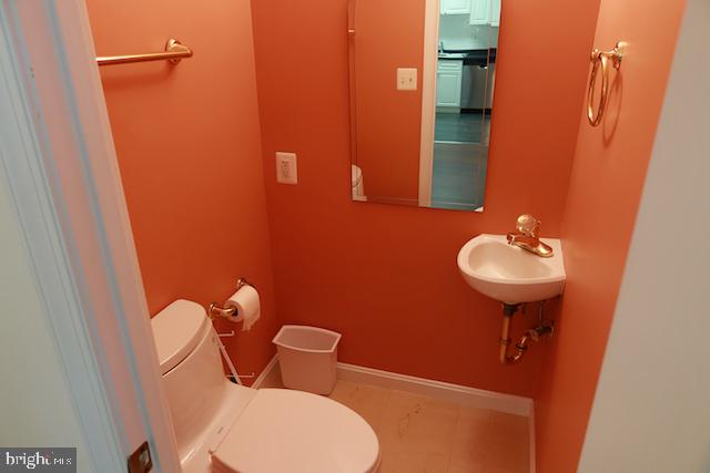 2151 Jamieson Avenue, Unit 411 Alexandria, VA 22314 - Photo 11 of 32 a bathroom with a sink and a mirror