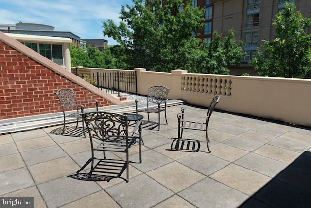 2151 Jamieson Avenue, Unit 411 Alexandria, VA 22314 - Photo 14 of 32 a view of a chairs and table in the balcony