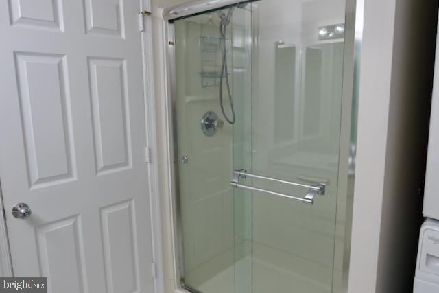 2151 Jamieson Avenue, Unit 411 Alexandria, VA 22314 - Photo 17 of 32 a bathroom with a glass shower door