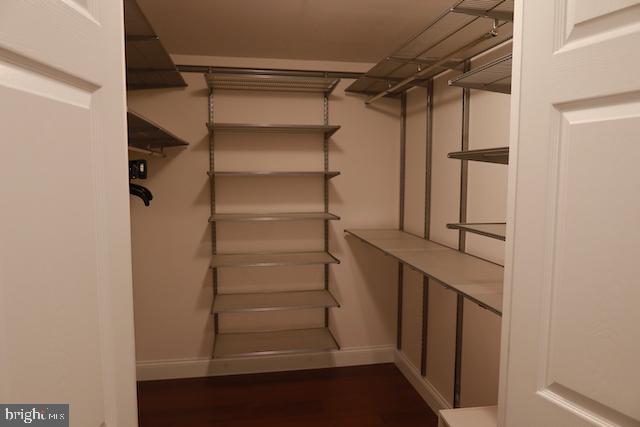 2151 Jamieson Avenue, Unit 411 Alexandria, VA 22314 - Photo 21 of 32 a view of walk in closet with empty racks