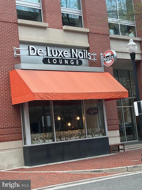 2151 Jamieson Avenue, Unit 411 Alexandria, VA 22314 - Photo 30 of 32 a front view of a building with entryway