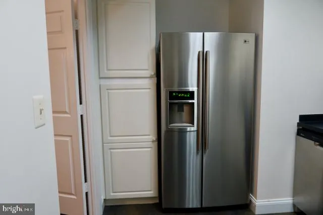 a view of a refrigerator in kitchen and a refrigerator