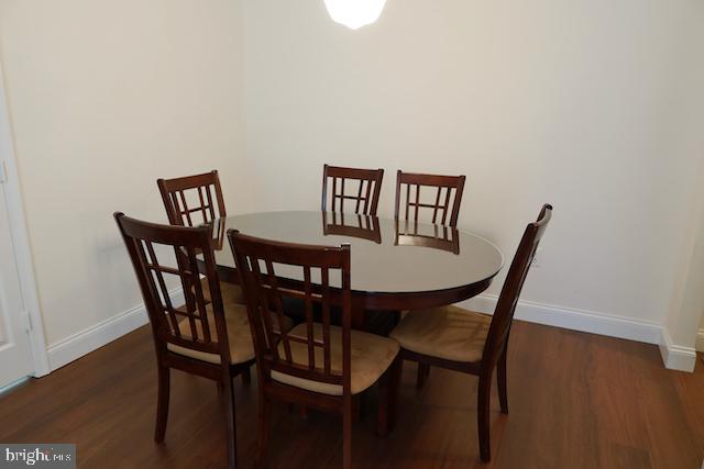 2151 Jamieson Avenue, Unit 411 Alexandria, VA 22314 - Photo 8 of 32 a view of a dining room with furniture and wooden floor