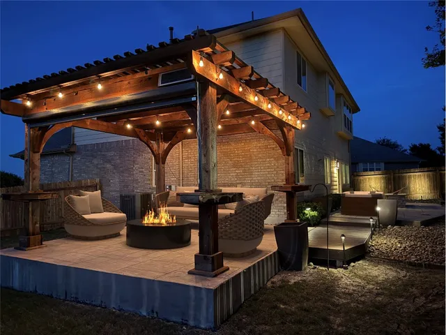 a view of a couches and dinning table in the patio