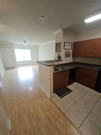 a kitchen with stainless steel appliances a stove a sink and a refrigerator