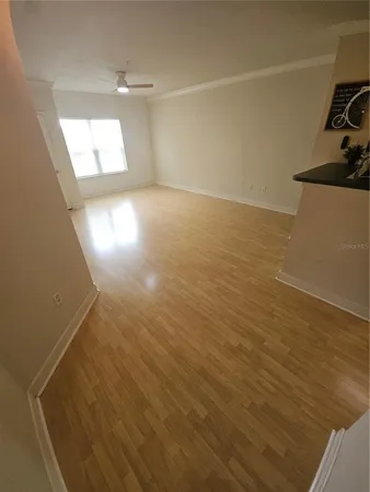 a view of a room with wooden floor and sink