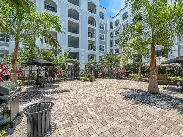 a view of balcony with plants and wooden fence