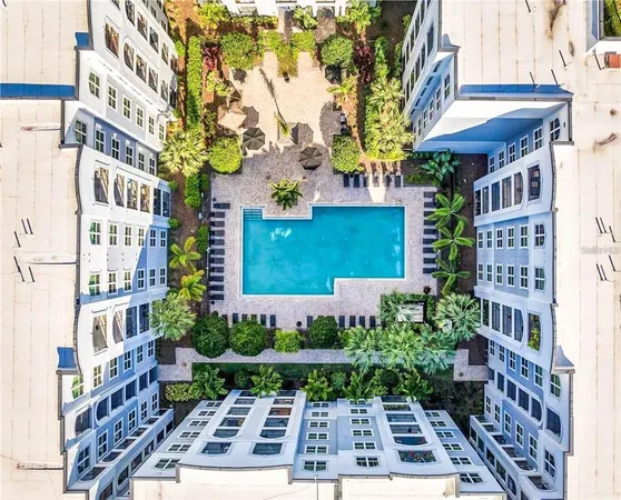 a swimming pool with outdoor seating and yard
