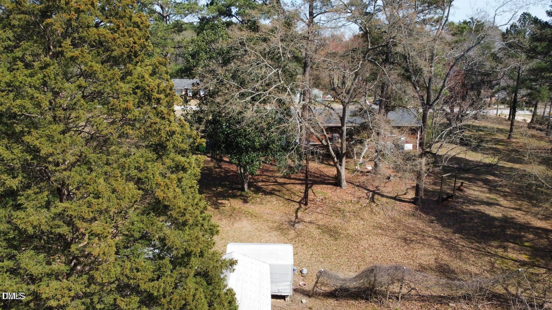 640 Sunnybrook Road Raleigh, NC 27610 - Photo 3 of 7 a backyard of a house with table and chairs
