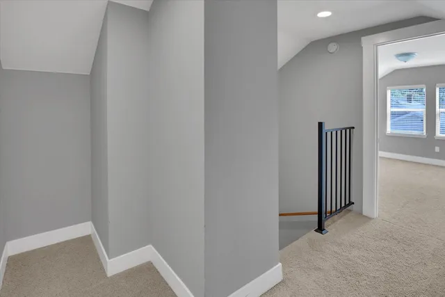 a view of a livingroom with wooden floor and windows