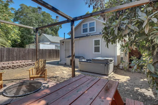 a view of a backyard with sitting area