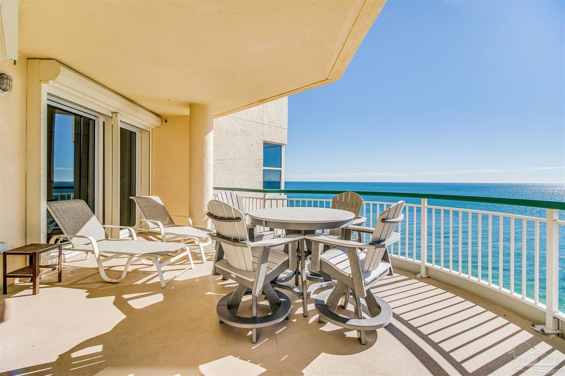 13601 Perdido Key Drive, Unit W18C Perdido Key, FL 32507 - Photo 12 of 30 a view of a patio with chairs and tables