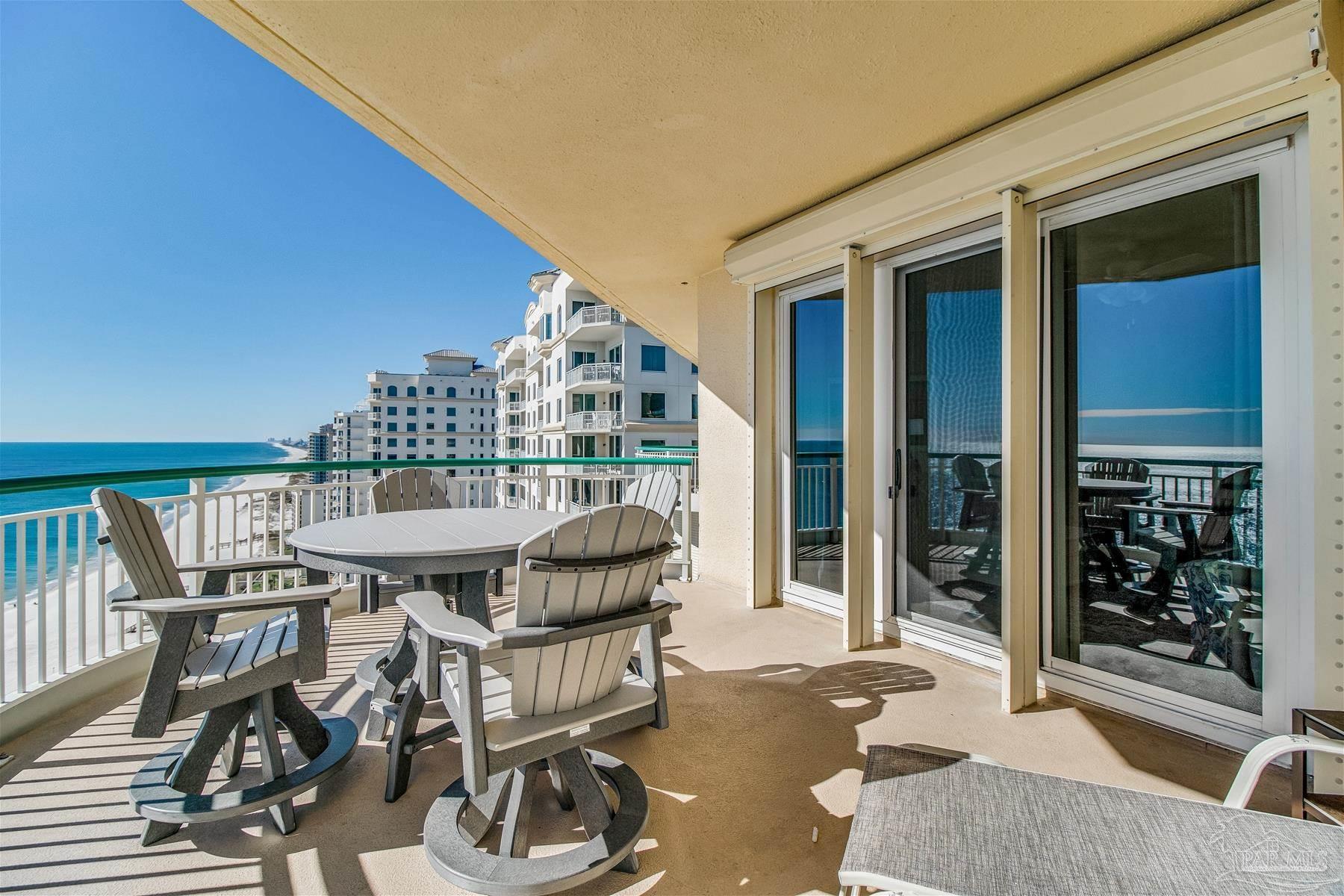 13601 Perdido Key Drive, Unit W18C Perdido Key, FL 32507 - Photo 13 of 30 a view of a patio with table and chairs