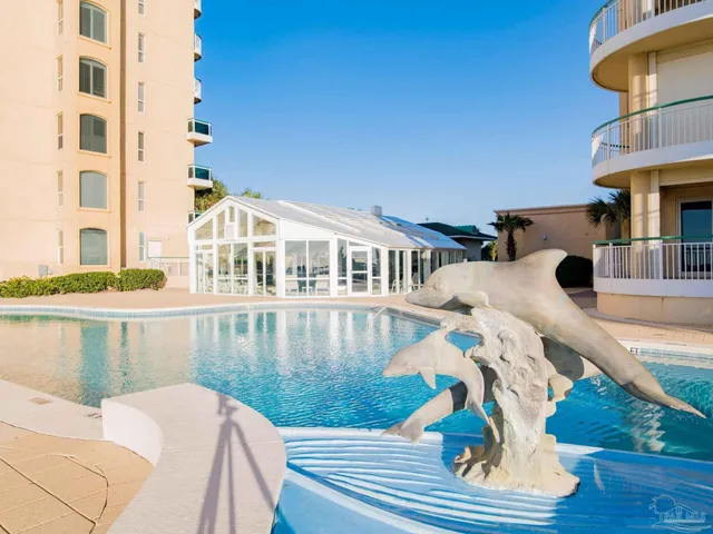a view of balcony with two chairs and wooden floor