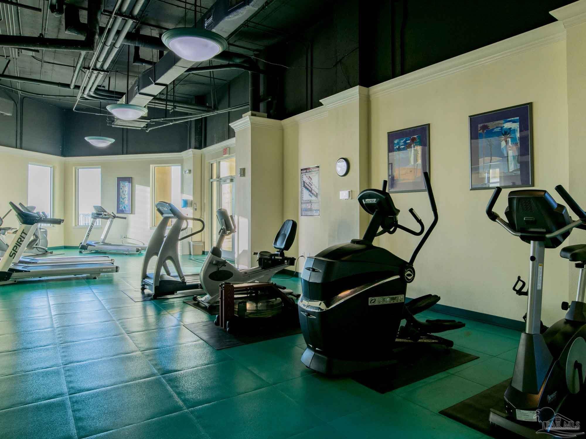 13601 Perdido Key Drive, Unit W18C Perdido Key, FL 32507 - Photo 20 of 30 a room with gym equipment and a large window