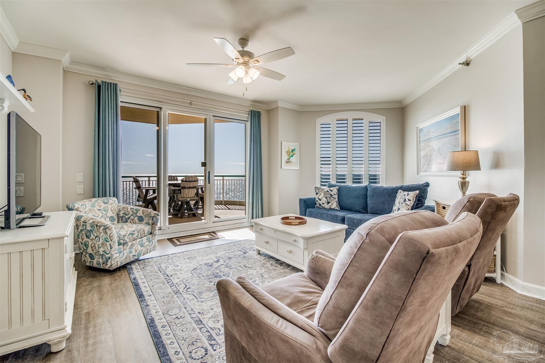 13601 Perdido Key Drive, Unit W18C Perdido Key, FL 32507 - Photo 2 of 30 a living room with furniture fireplace and a flat screen tv