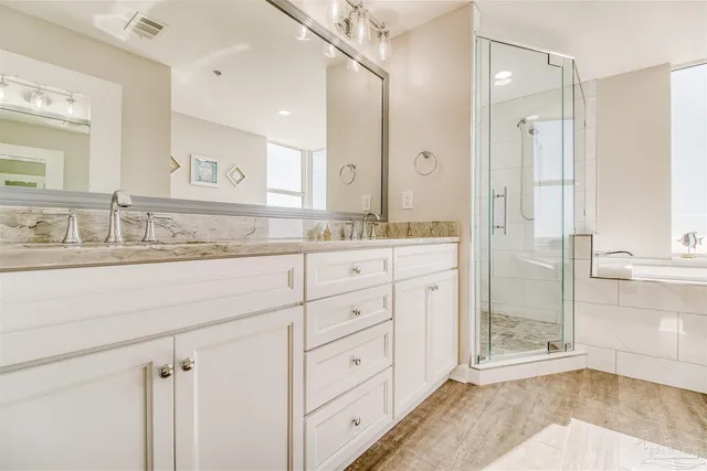 a bathroom with a granite countertop sink mirror and double