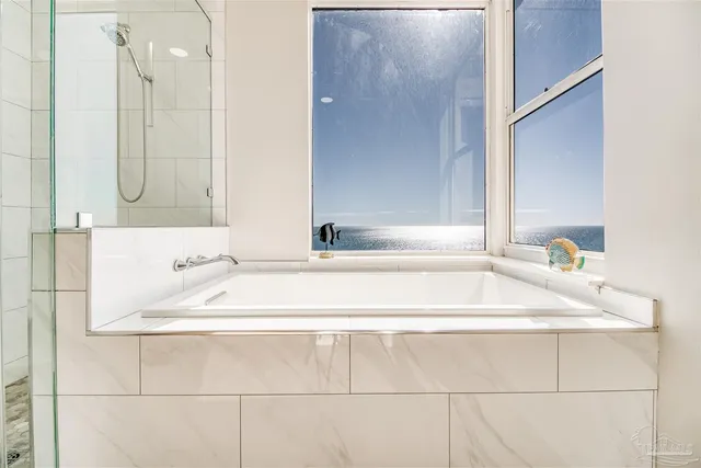 a bathroom with a bathtub and a sink