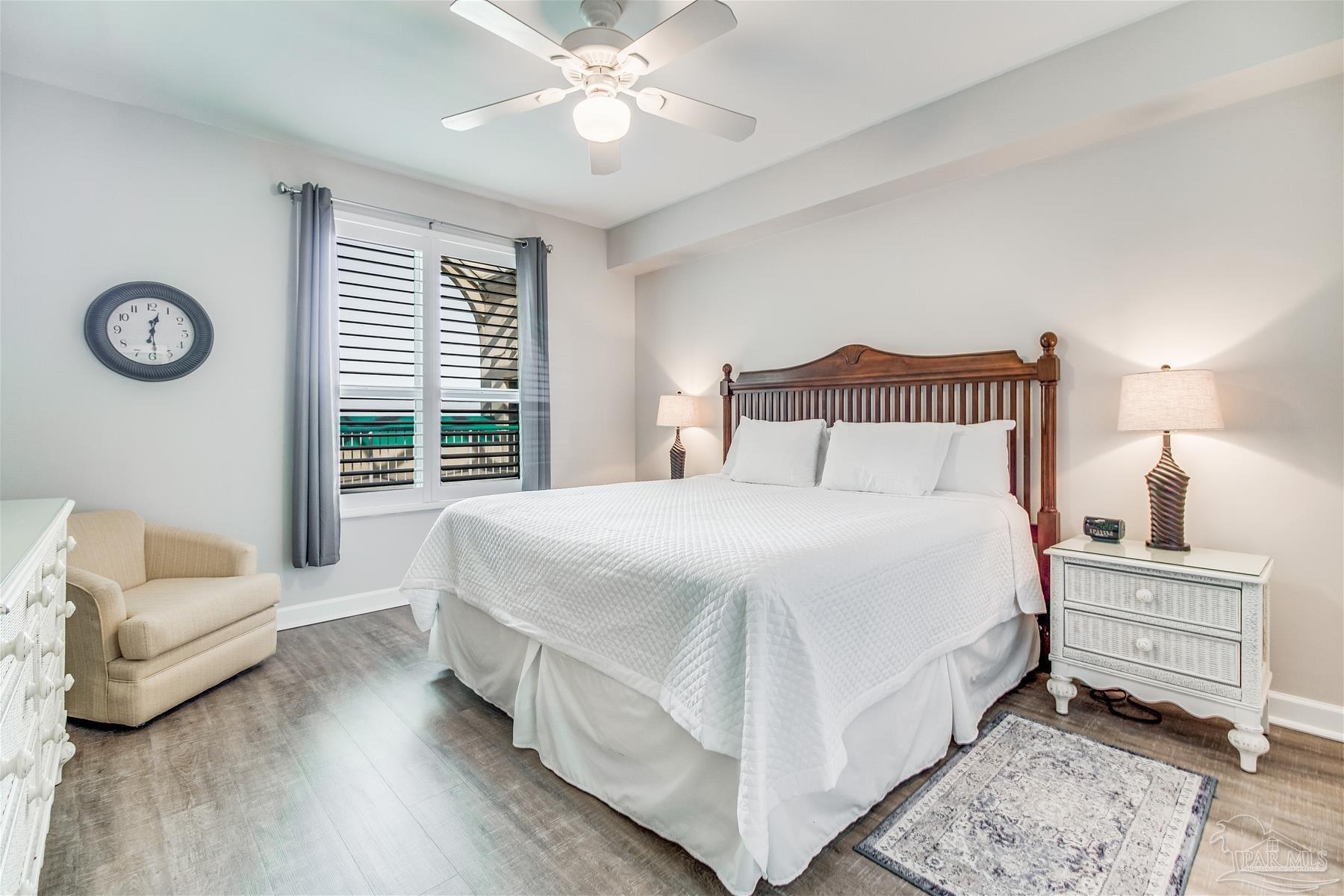 13601 Perdido Key Drive, Unit W18C Perdido Key, FL 32507 - Photo 9 of 30 a bedroom with a bed and a couch