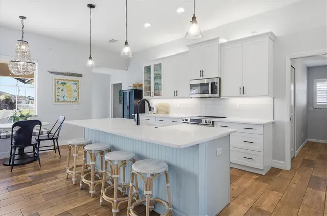 a bedroom with a bed and a dresser with the shoe rack