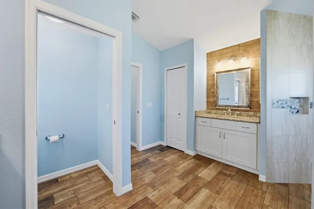 a view of a dining room and hall with furniture