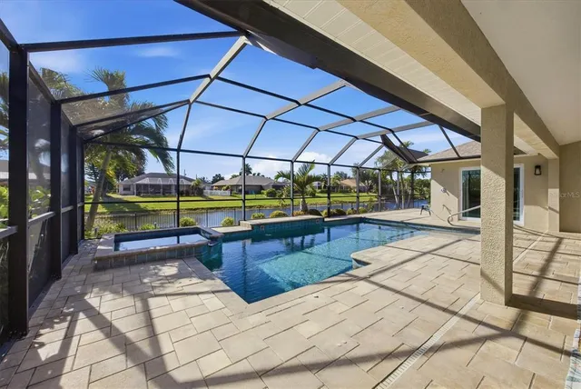 a view of a park with a house in the background