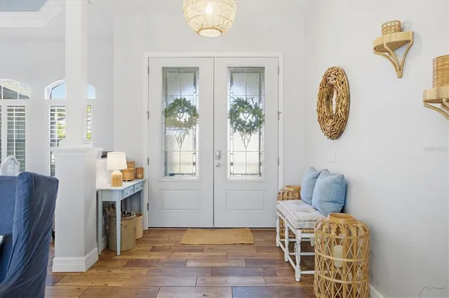 a living room with furniture and a view of kitchen
