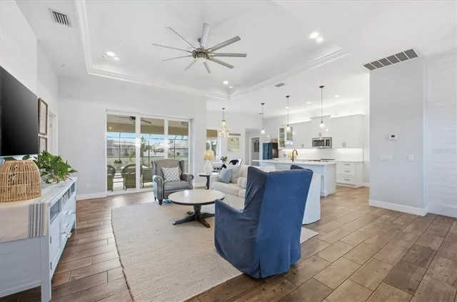 a view of a dining room with furniture and a window