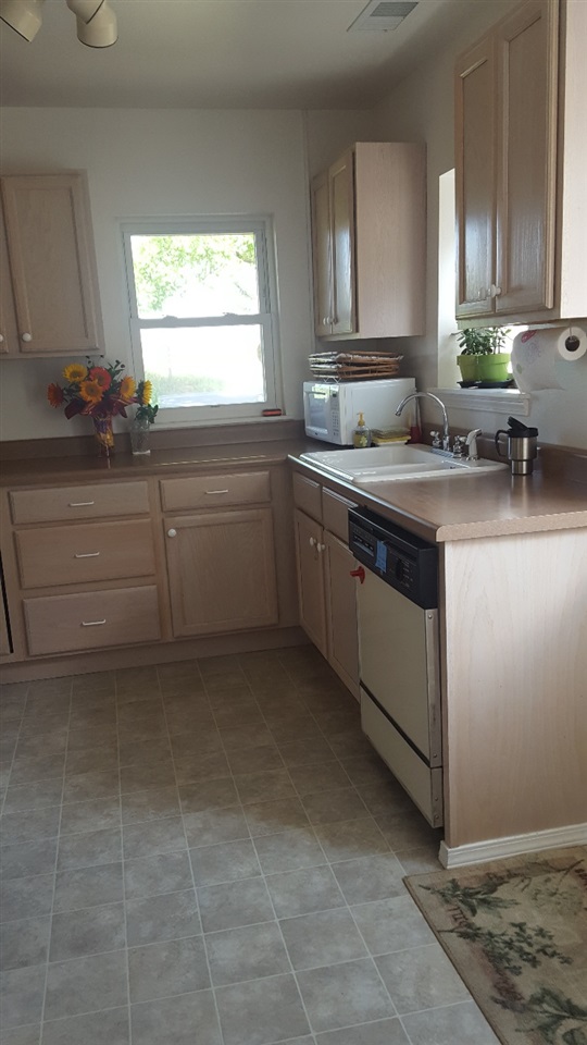 837 26 Road Grand Junction, CO 81505 - Photo 11 of 38 a kitchen with a cabinets and window
