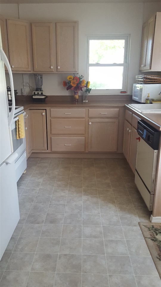 837 26 Road Grand Junction, CO 81505 - Photo 9 of 38 a kitchen with a sink a stove and cabinets