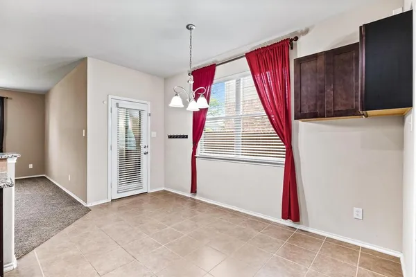 a view of a livingroom with wooden floor and stairs