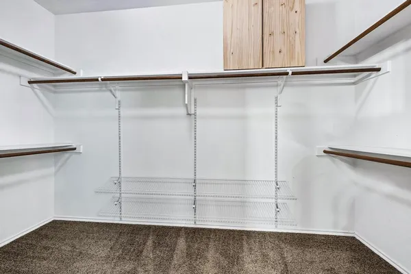 a view of an empty walk in closet