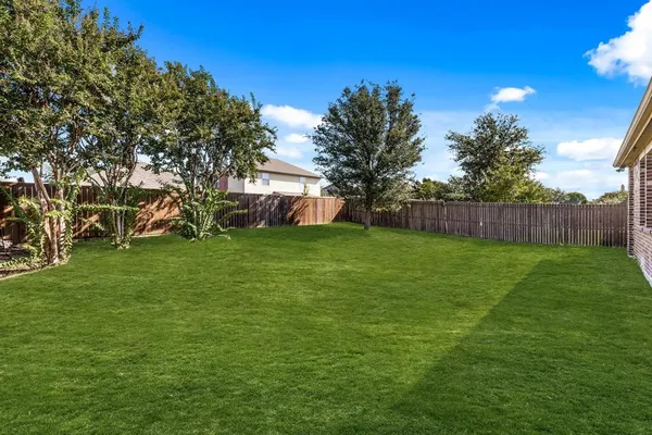 a view of a backyard with a garden