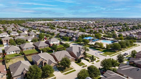an aerial view of residential houses with outdoor space
