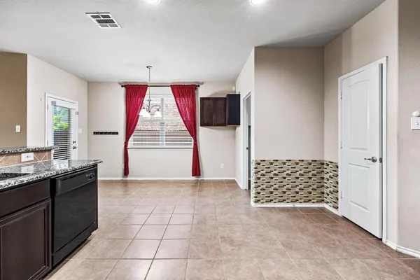 a view of kitchen with windows and sink