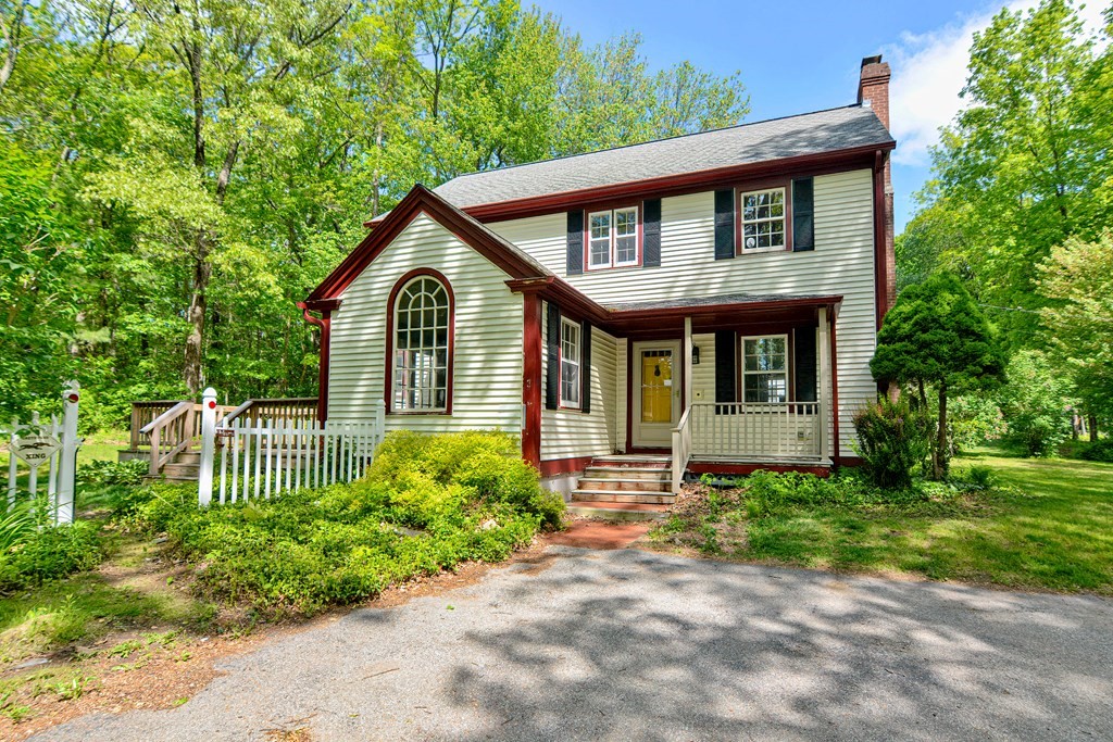 111 Center Depot Road Charlton, MA 01507 - Photo 1 of 42 a front view of a house with a garden