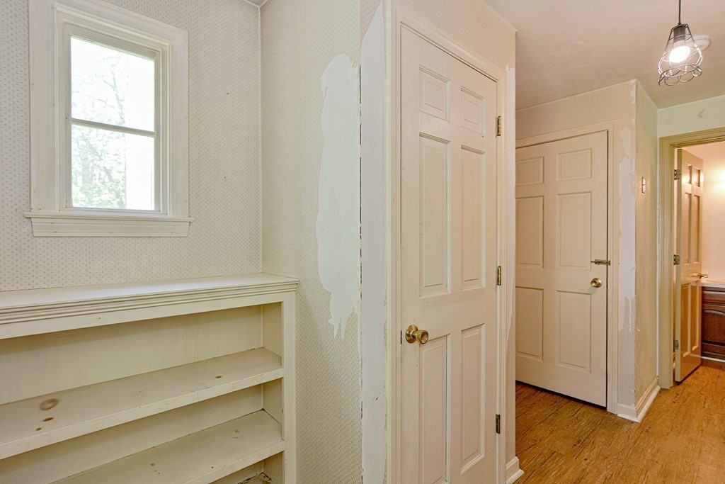 111 Center Depot Road Charlton, MA 01507 - Photo 31 of 42 a view of an empty room with wooden floor and a window