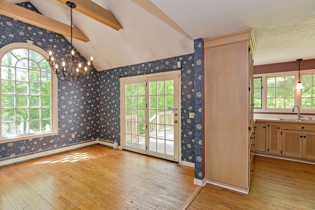111 Center Depot Road Charlton, MA 01507 - Photo 10 of 42 a view of empty room with wooden floor and fan
