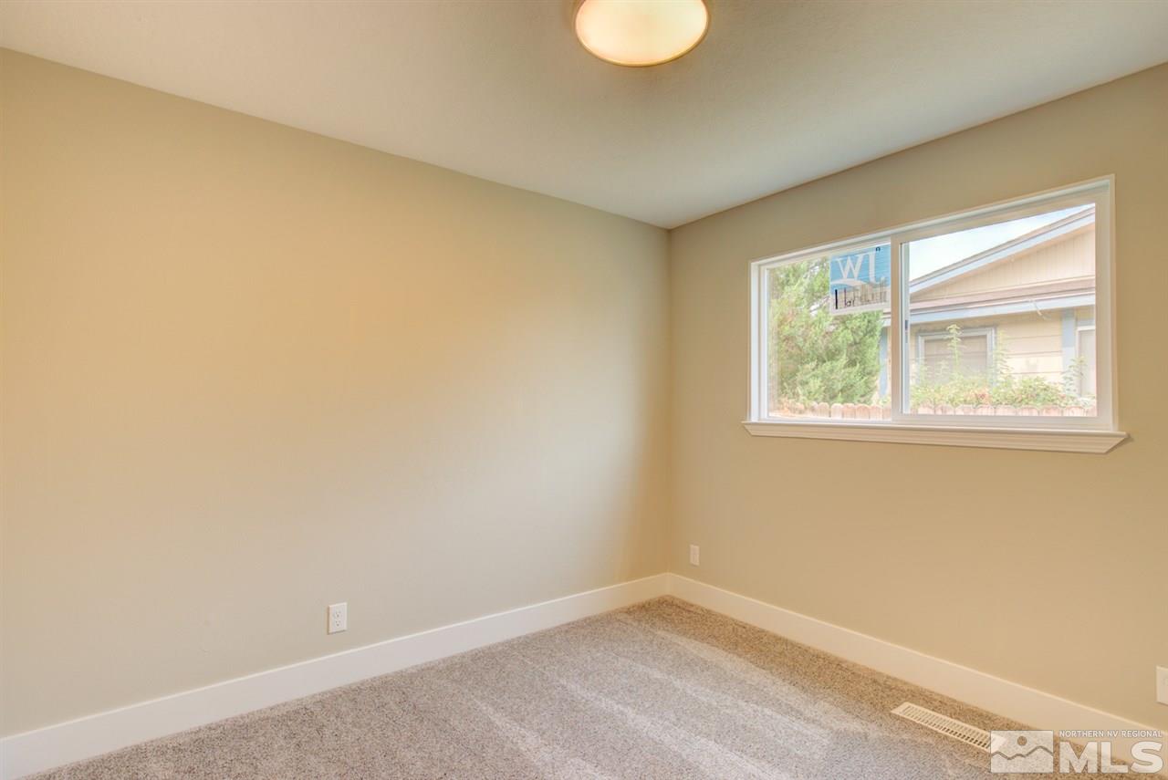 6755 Lotus Street Reno, NV 89506 - Photo 19 of 27 a view of an empty room with a window